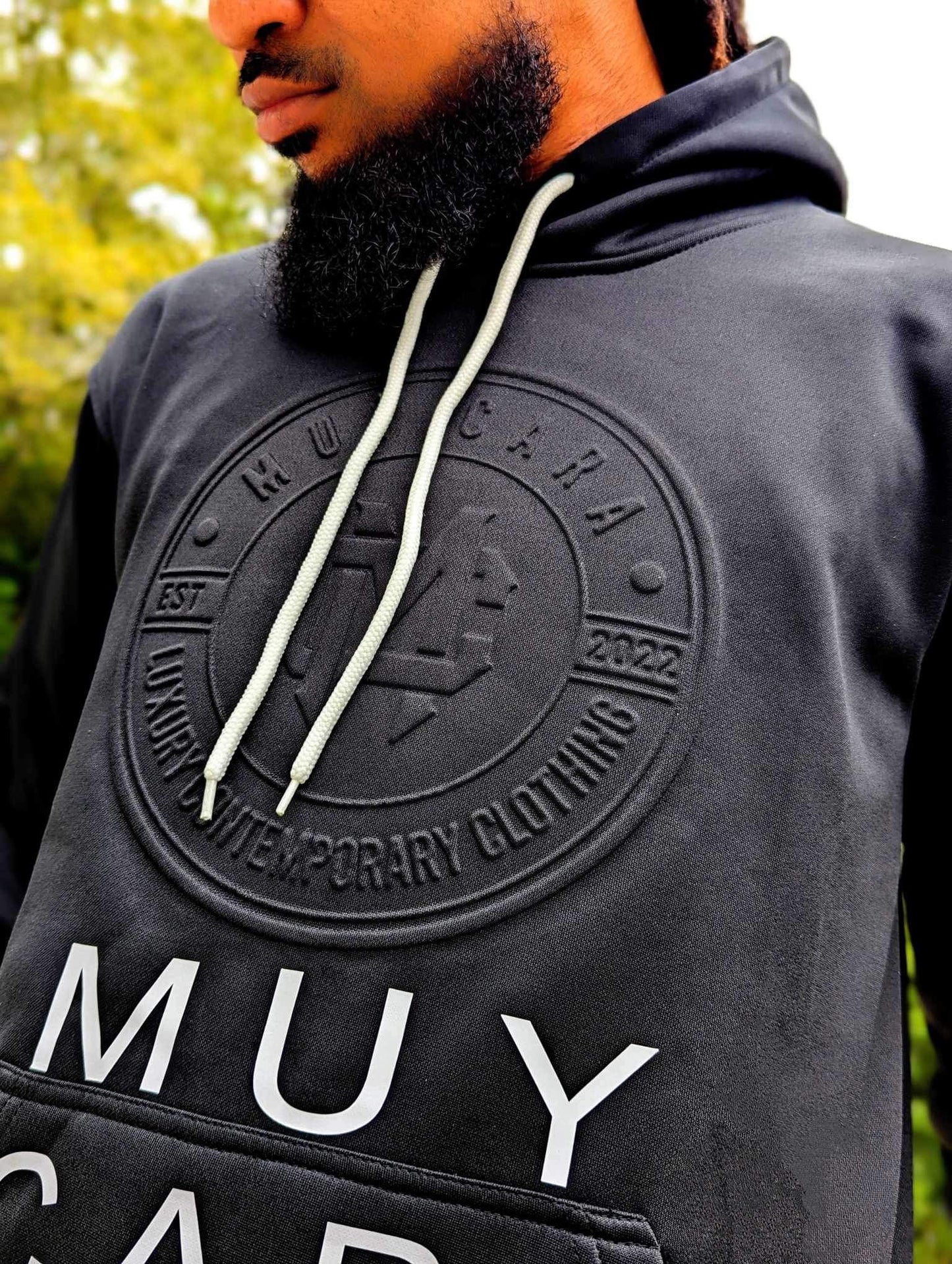 (🚨Just Released🚨)UNISEX EMBOSSED BLACK HOODY - www.muycara.com